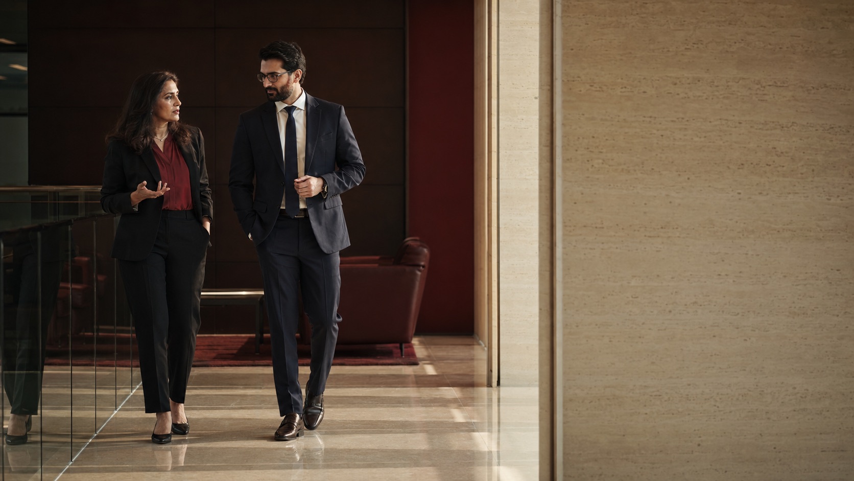 Two advisors discussing organizational priorities while walking